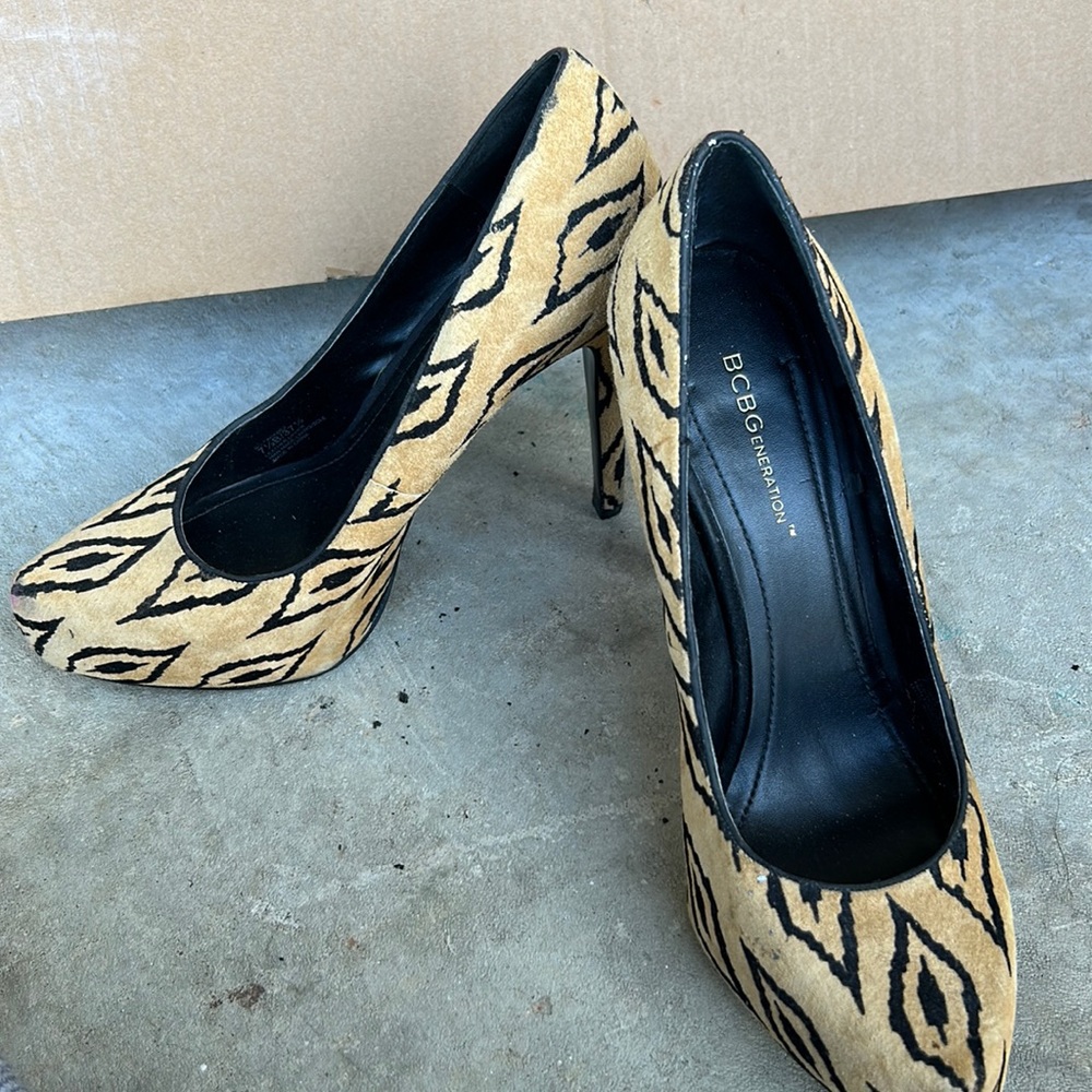 Tan and black heeled shoes